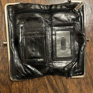 Women's Hobo Black Leather Lauren Clutch Wallet and coach wallet.